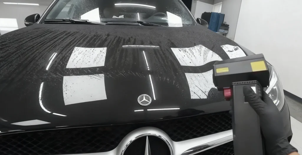 An image of using a Booster TF64 Air Blower to dry a car.